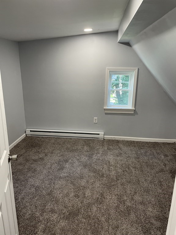 408 Nottingham Street Springfield, MA 01104 - Photo 9 of 12 an empty room with a workbench