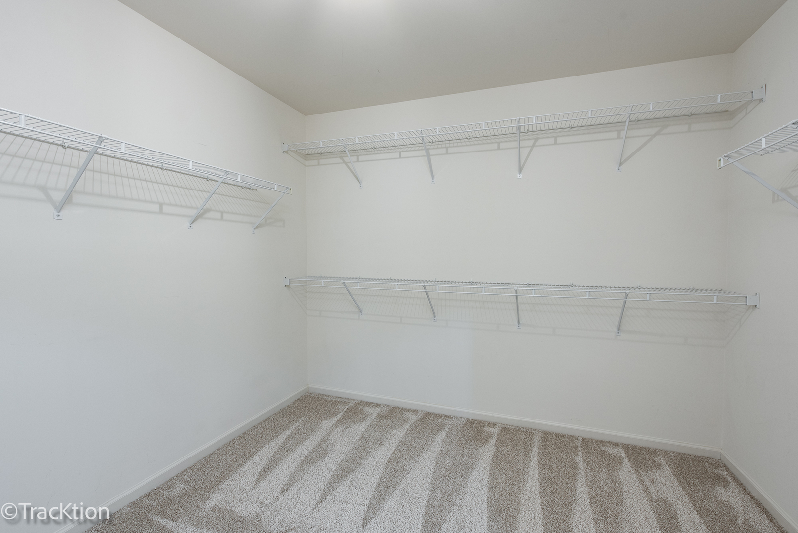 220 Brompton Lane, Unit A Sugar Grove, IL 60554 - Photo 14 of 19 a view of a room with racks on the wall