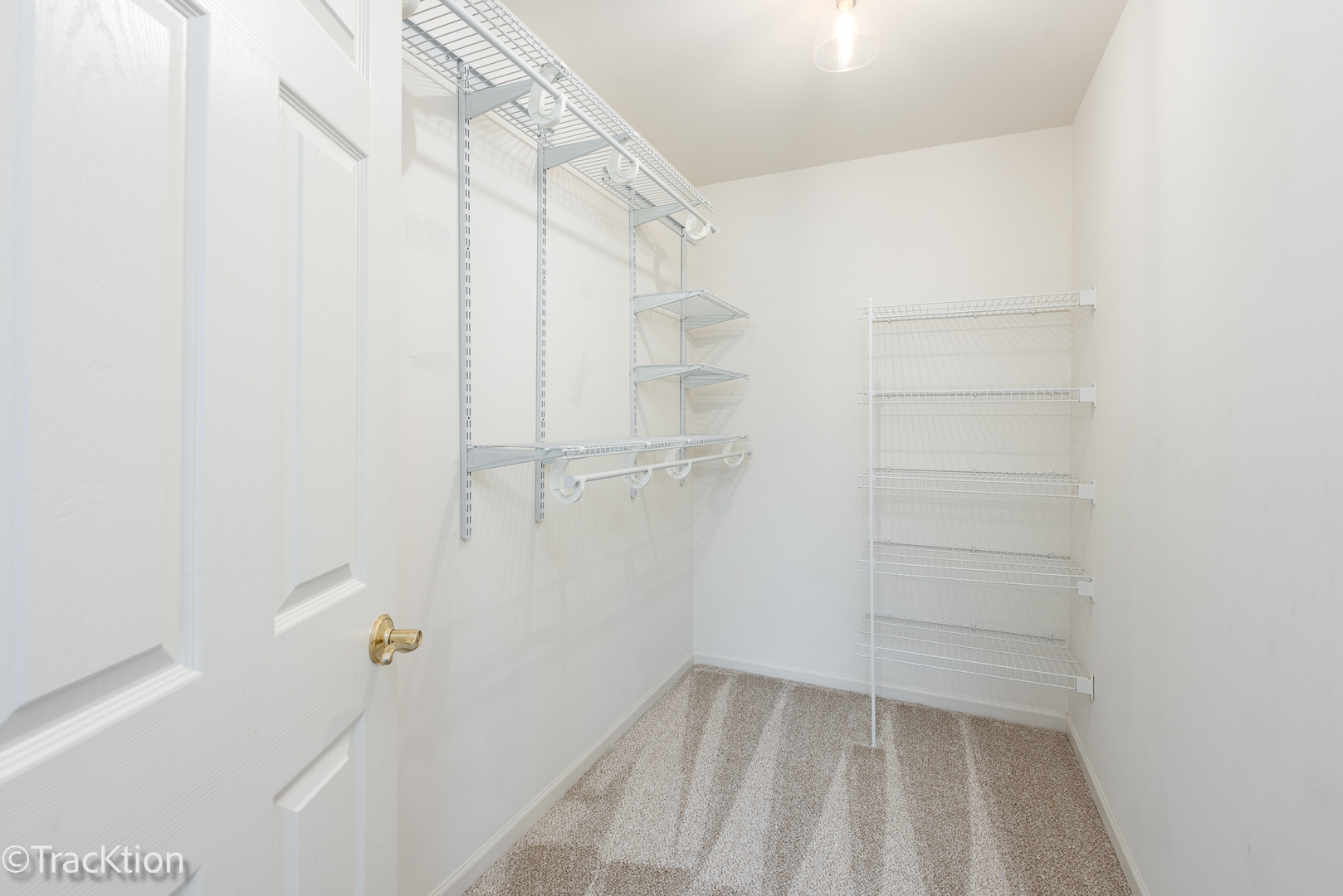 220 Brompton Lane, Unit A Sugar Grove, IL 60554 - Photo 16 of 19 a view of walk in closet with empty racks