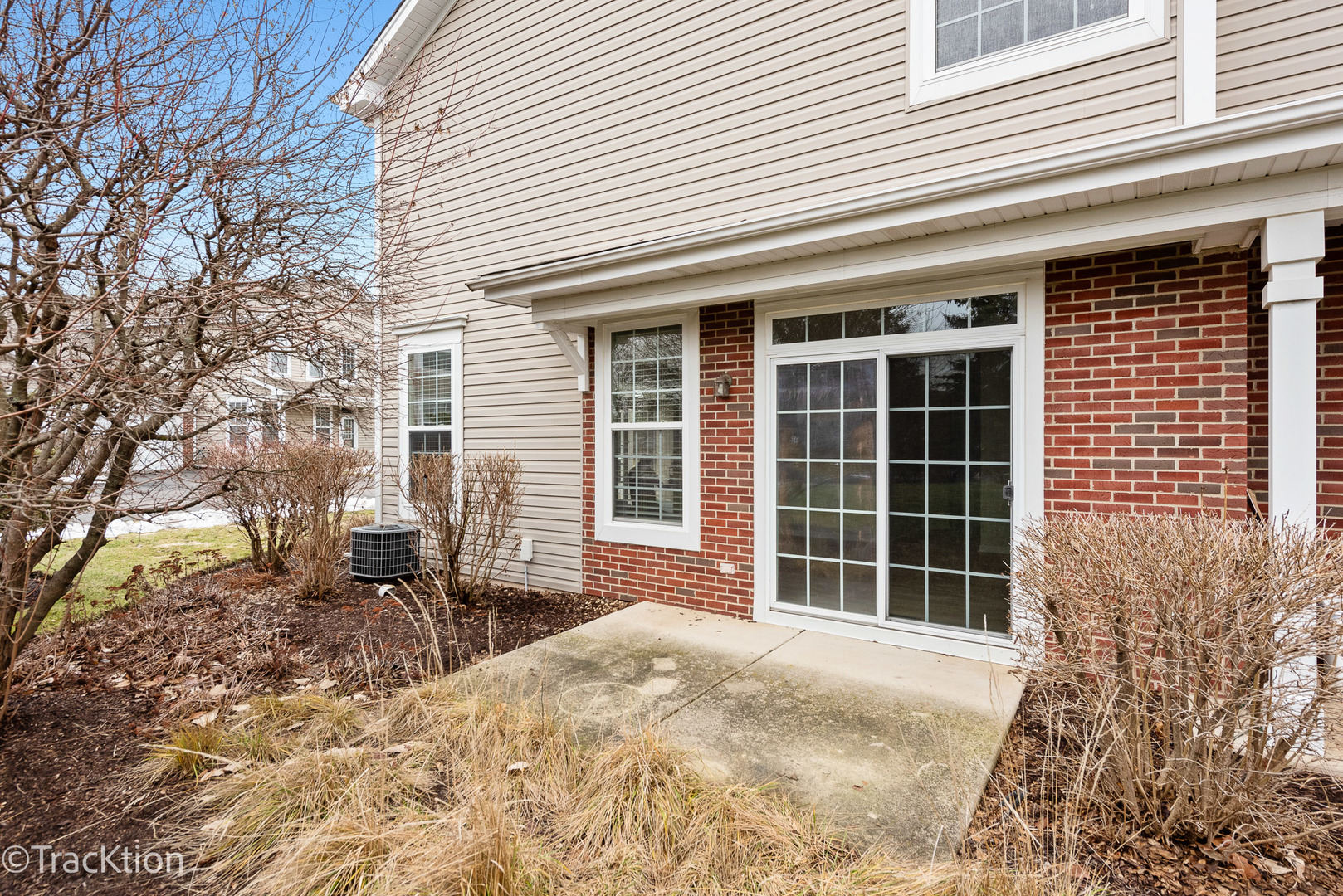 220 Brompton Lane, Unit A Sugar Grove, IL 60554 - Photo 19 of 19 a front view of a house with a yard and balcony