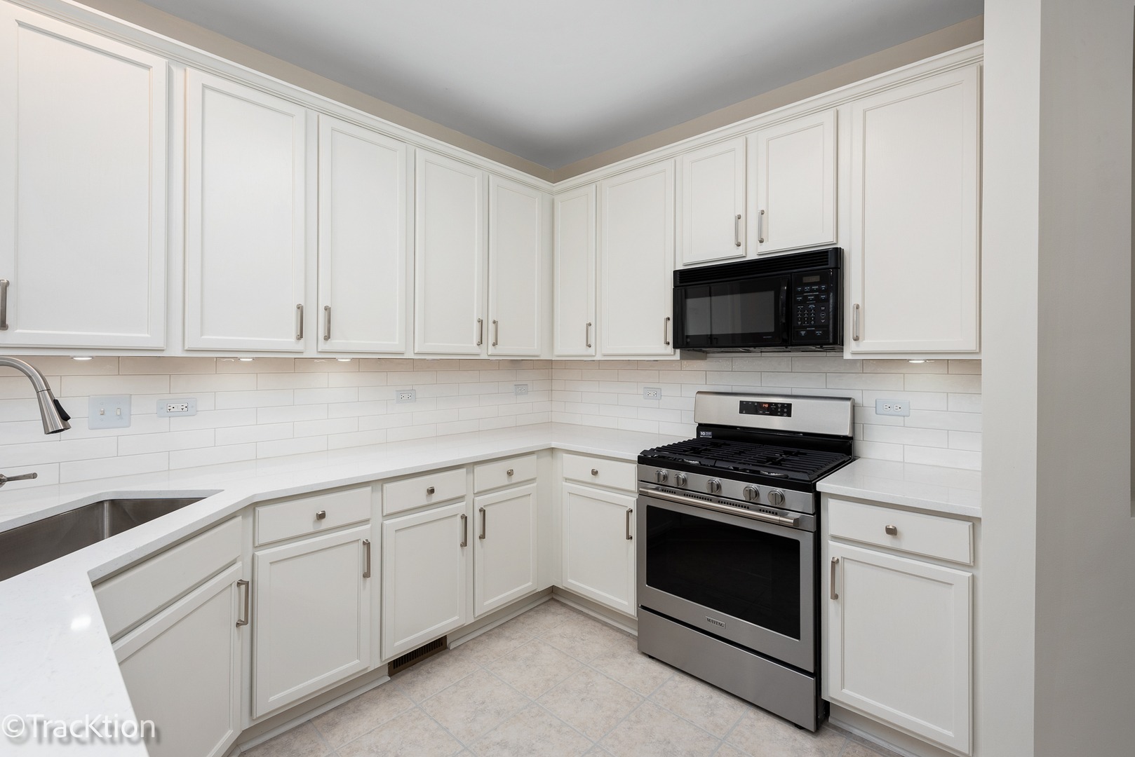 220 Brompton Lane, Unit A Sugar Grove, IL 60554 - Photo 2 of 19 a kitchen with white cabinets and black appliances