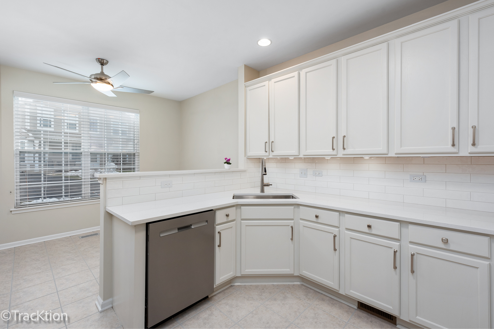 220 Brompton Lane, Unit A Sugar Grove, IL 60554 - Photo 3 of 19 a kitchen with white cabinets appliances a sink and a window