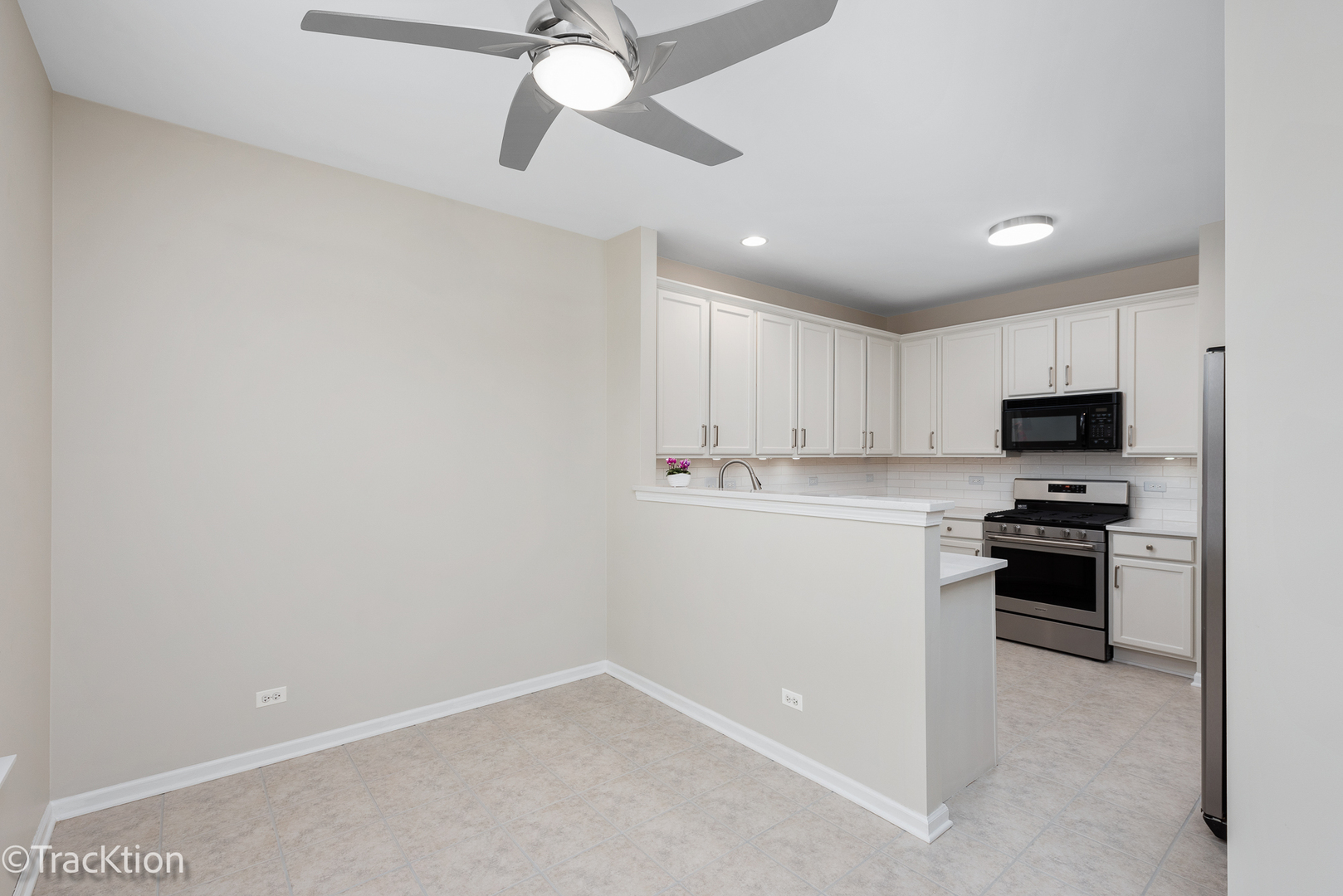 220 Brompton Lane, Unit A Sugar Grove, IL 60554 - Photo 5 of 19 a kitchen with white cabinets and stainless steel appliances