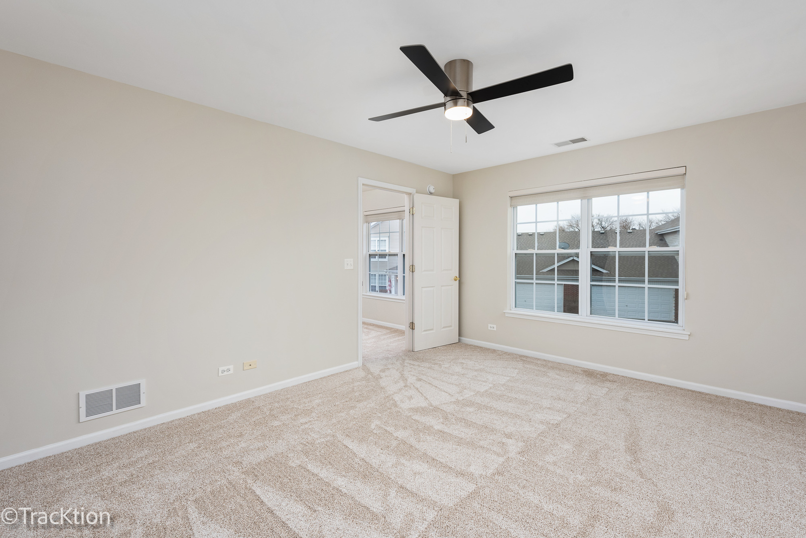 220 Brompton Lane, Unit A Sugar Grove, IL 60554 - Photo 10 of 19 a view of a livingroom with a ceiling fan and window