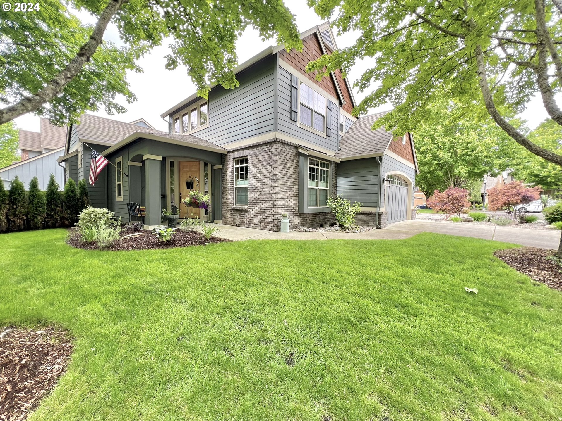 a front view of a house with garden