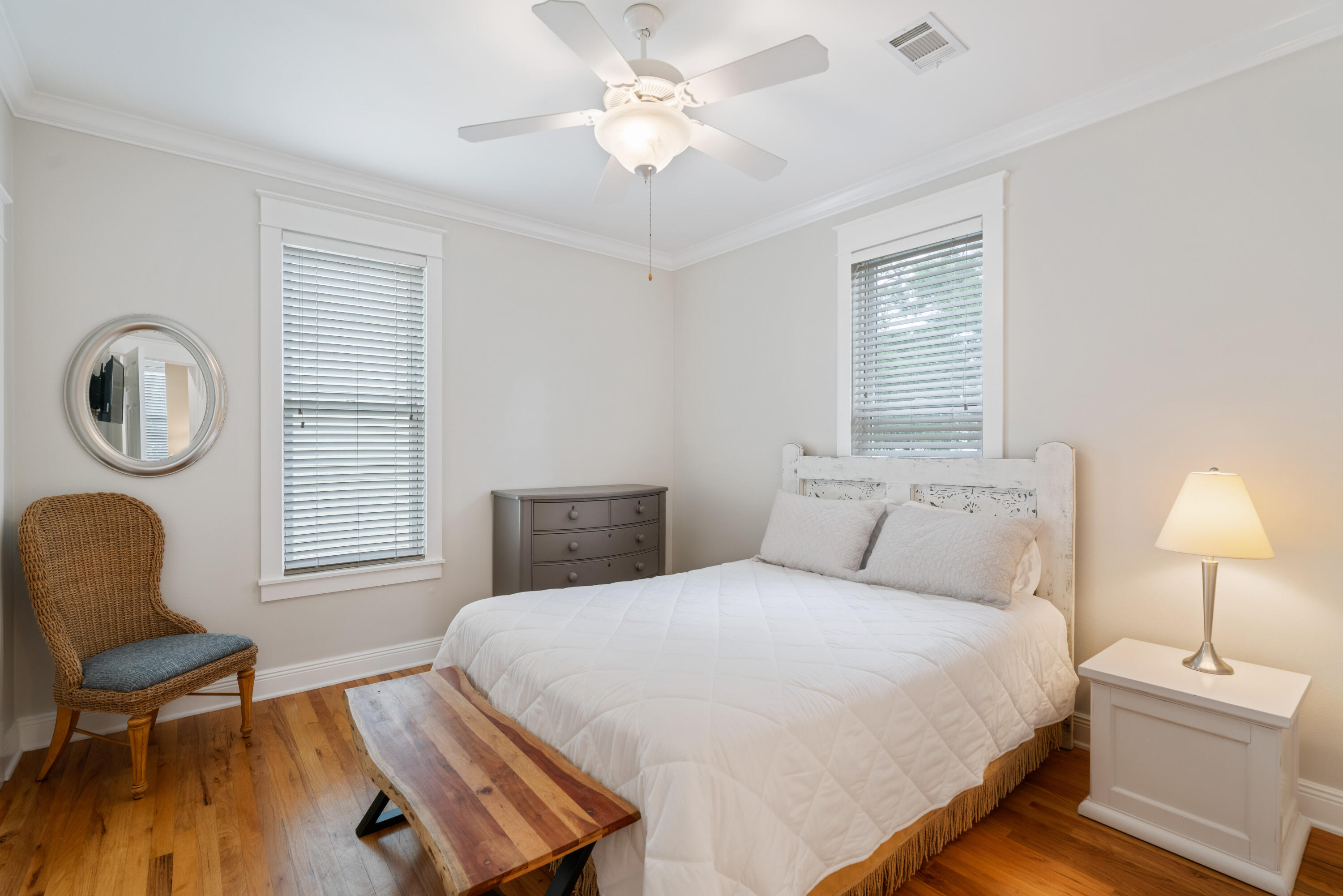 107 Chelsea Loop Road Santa Rosa Beach, FL 32459 - Photo 24 of 66 a bedroom with a bed a chair and a chandelier