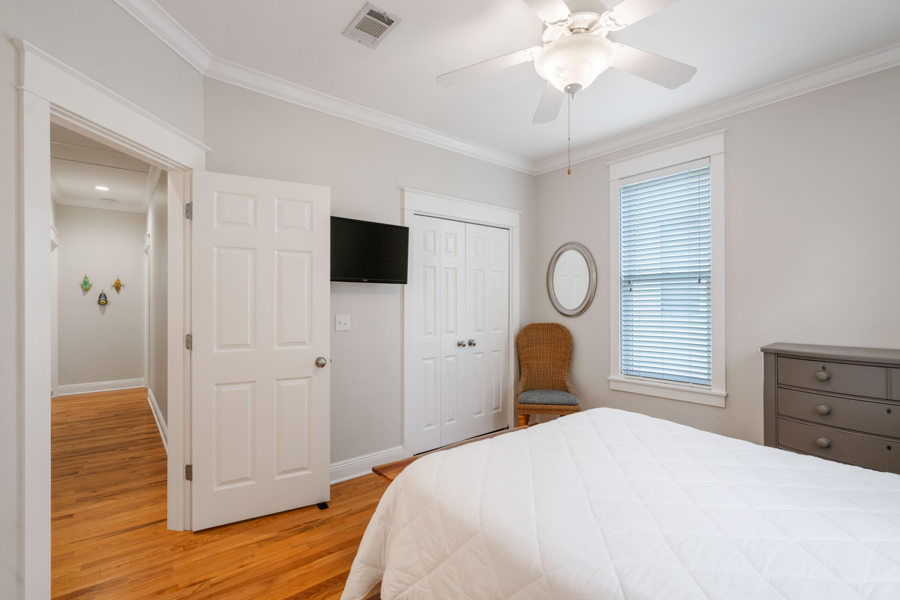 107 Chelsea Loop Road Santa Rosa Beach, FL 32459 - Photo 26 of 66 a bedroom with a bed and a chandelier