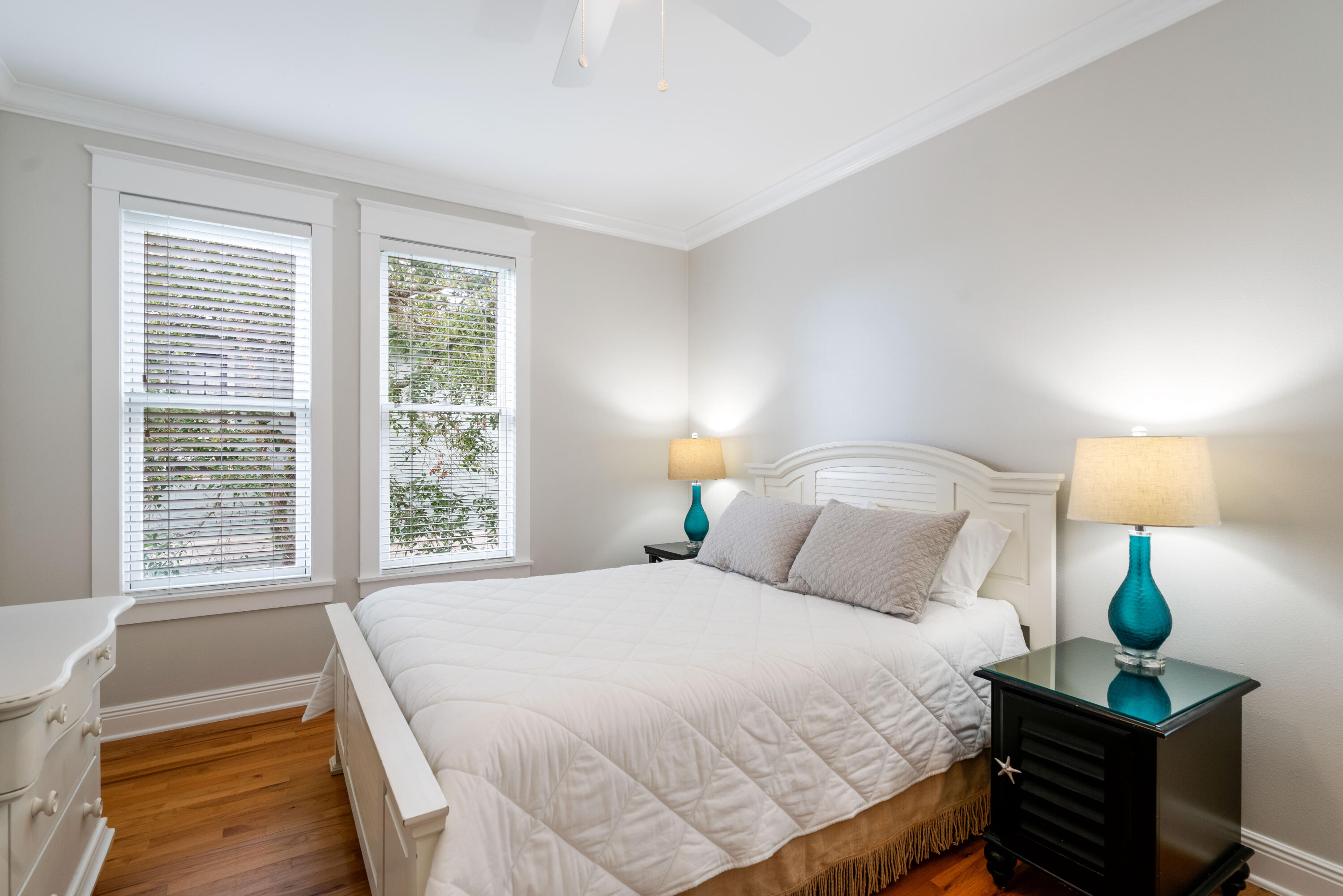 107 Chelsea Loop Road Santa Rosa Beach, FL 32459 - Photo 27 of 66 a bedroom with a bed and a lamp next to a window