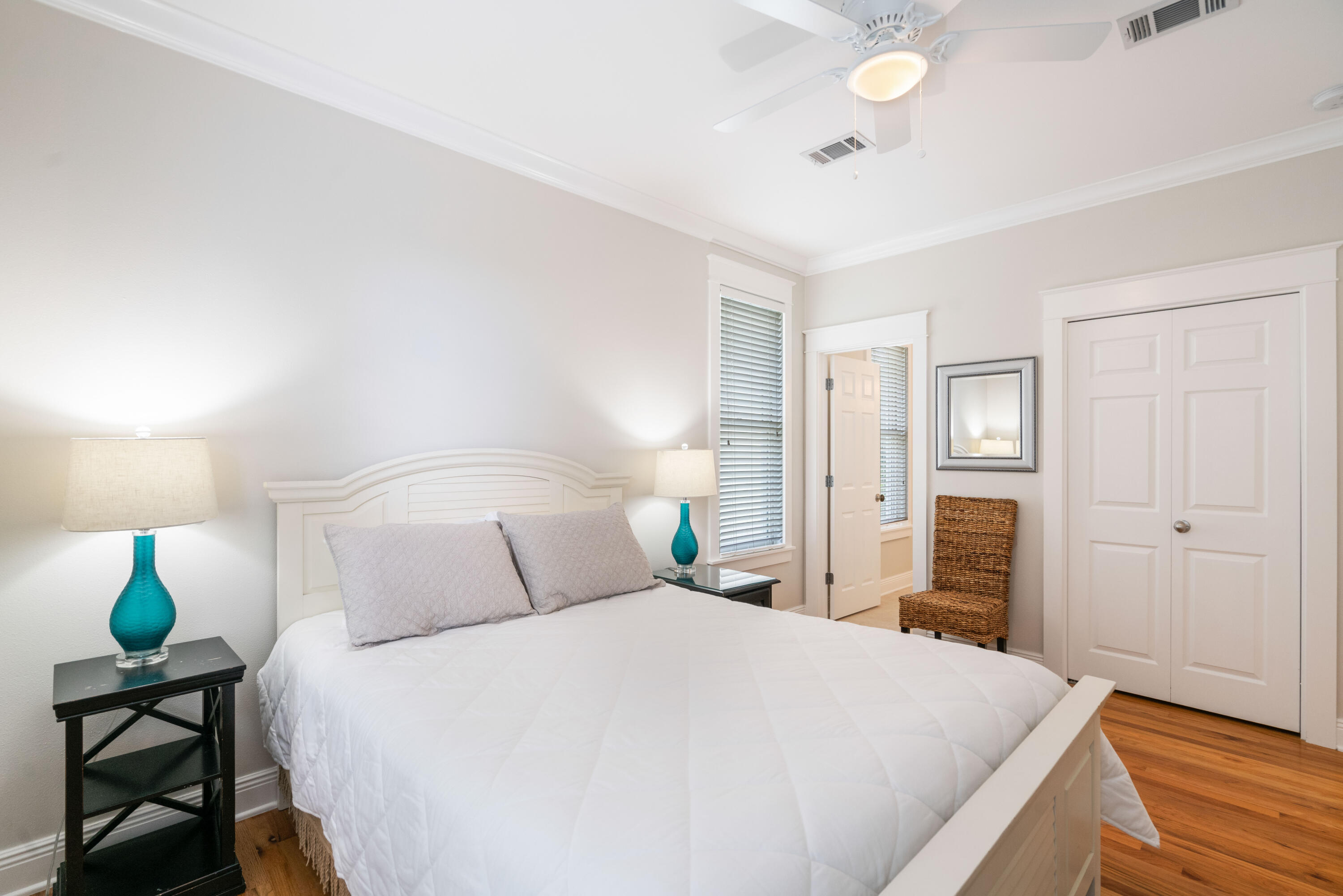 107 Chelsea Loop Road Santa Rosa Beach, FL 32459 - Photo 28 of 66 a bedroom with a bed and wooden floor