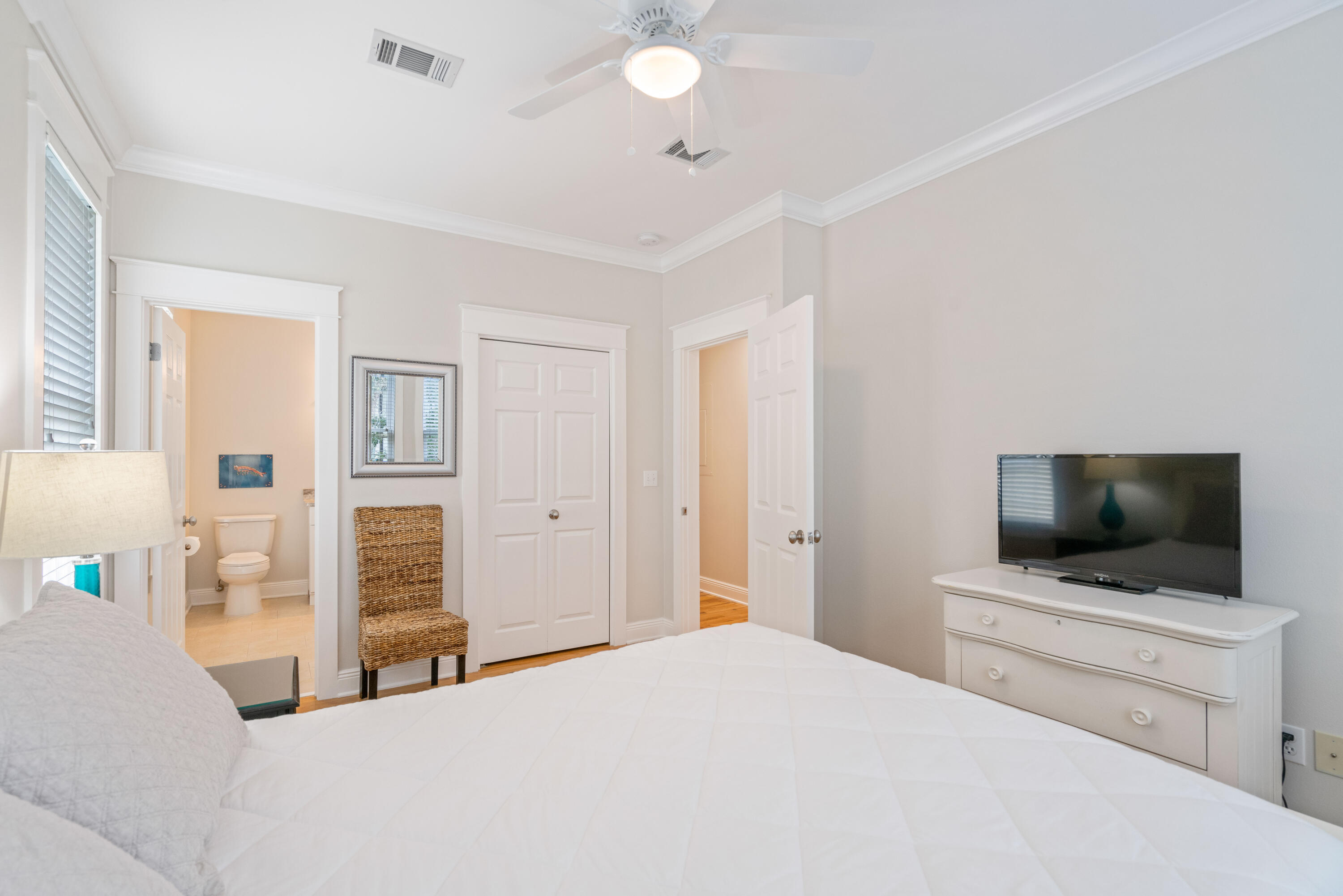 107 Chelsea Loop Road Santa Rosa Beach, FL 32459 - Photo 29 of 66 a bedroom with a bed and a flat screen tv