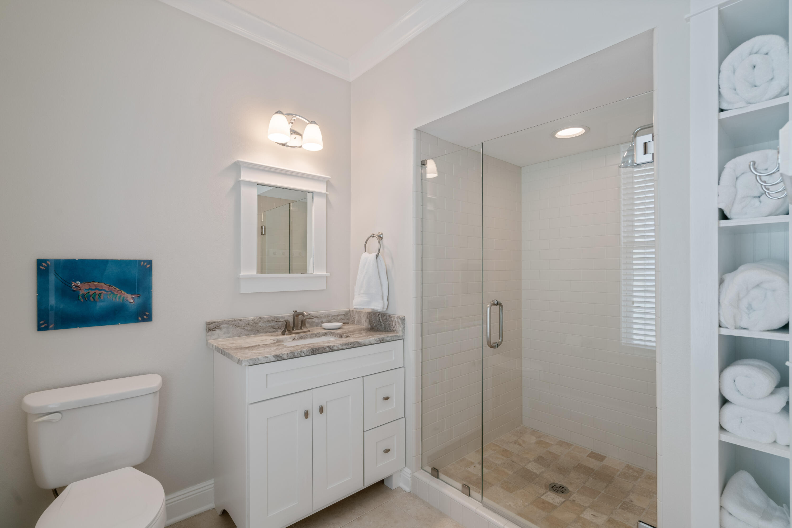 107 Chelsea Loop Road Santa Rosa Beach, FL 32459 - Photo 30 of 66 a bathroom with a toilet a sink and glass door