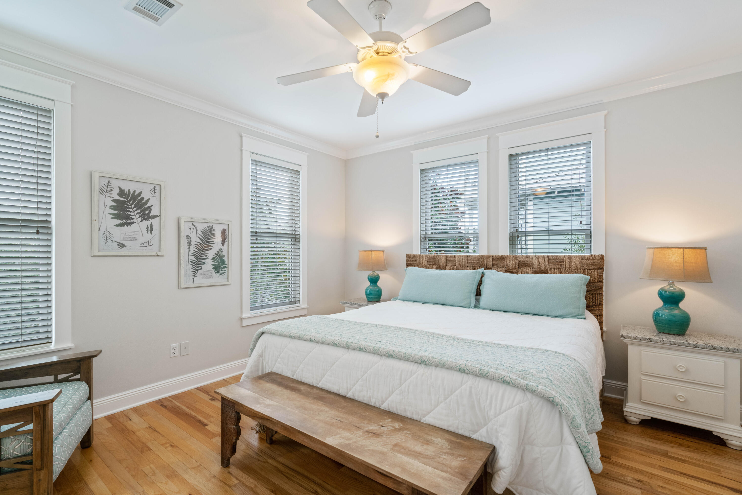 107 Chelsea Loop Road Santa Rosa Beach, FL 32459 - Photo 31 of 66 a bedroom with a bed and a chandelier
