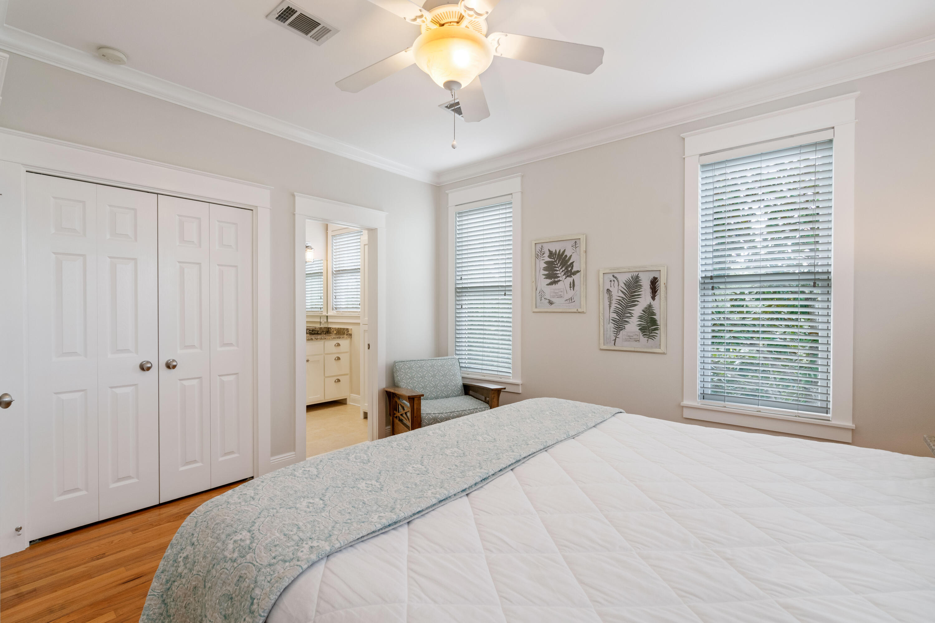 107 Chelsea Loop Road Santa Rosa Beach, FL 32459 - Photo 32 of 66 a bedroom with a bed and a chandelier