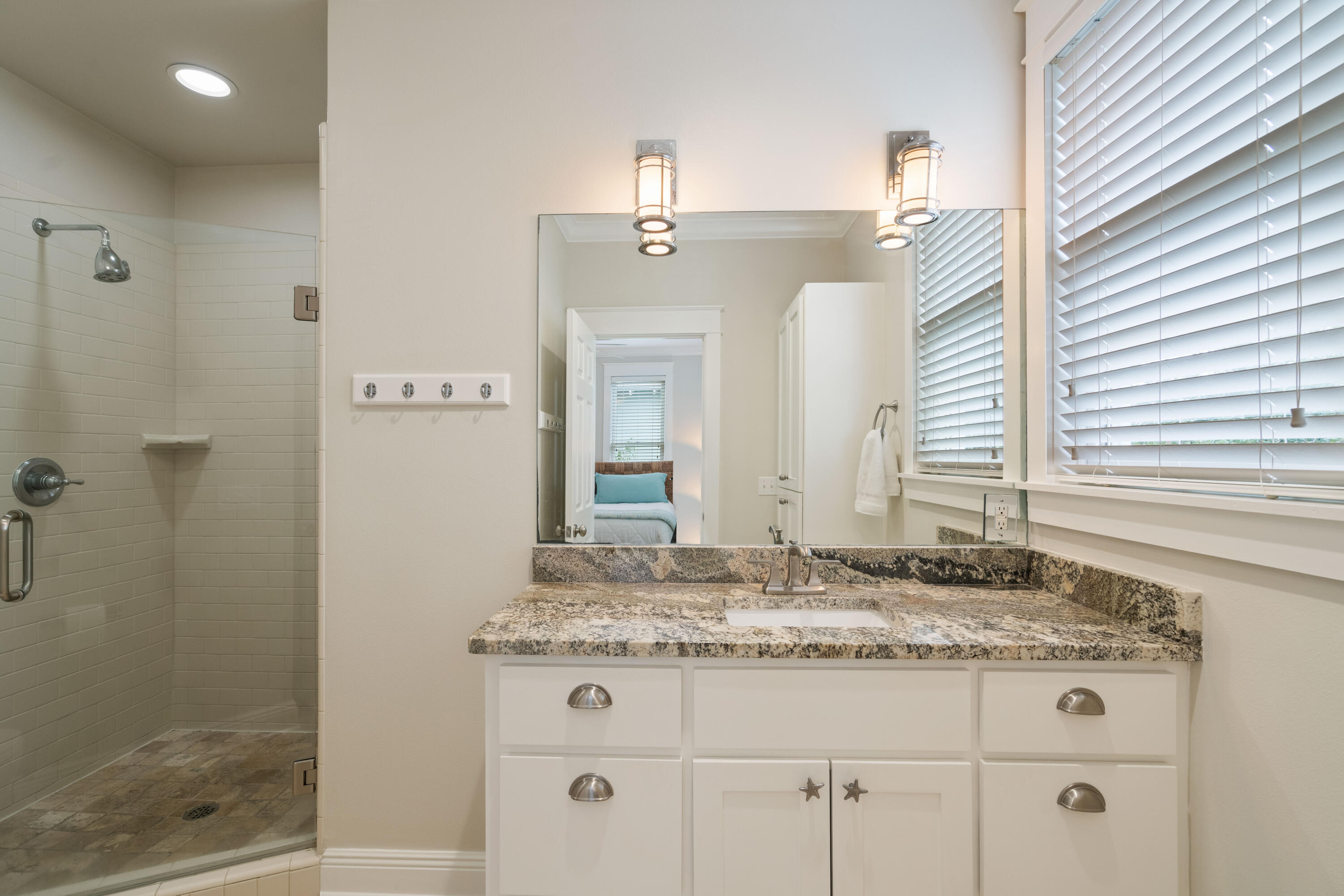 107 Chelsea Loop Road Santa Rosa Beach, FL 32459 - Photo 34 of 66 a bathroom with a granite countertop sink and a mirror