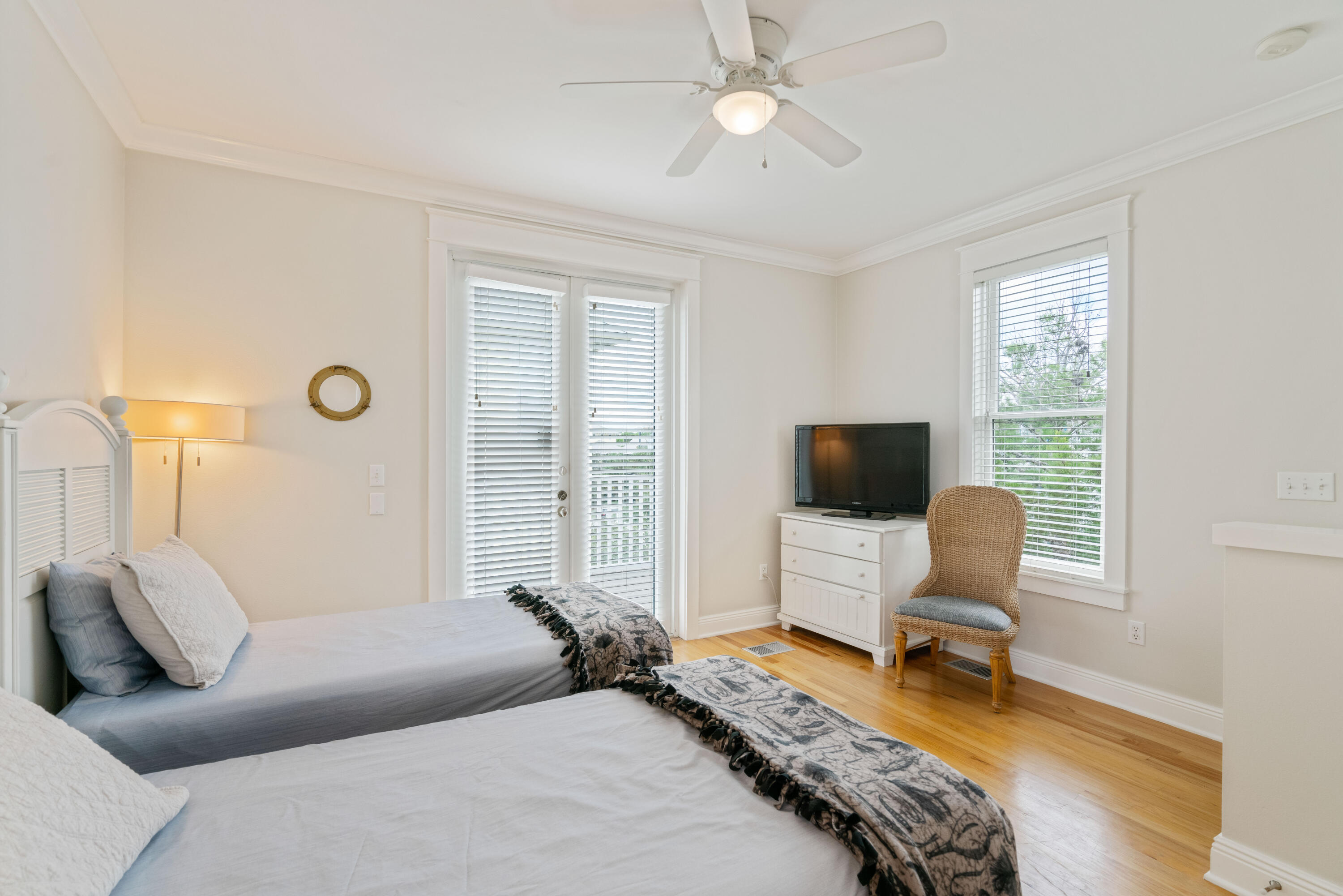 107 Chelsea Loop Road Santa Rosa Beach, FL 32459 - Photo 36 of 66 a bedroom with a bed and a chair