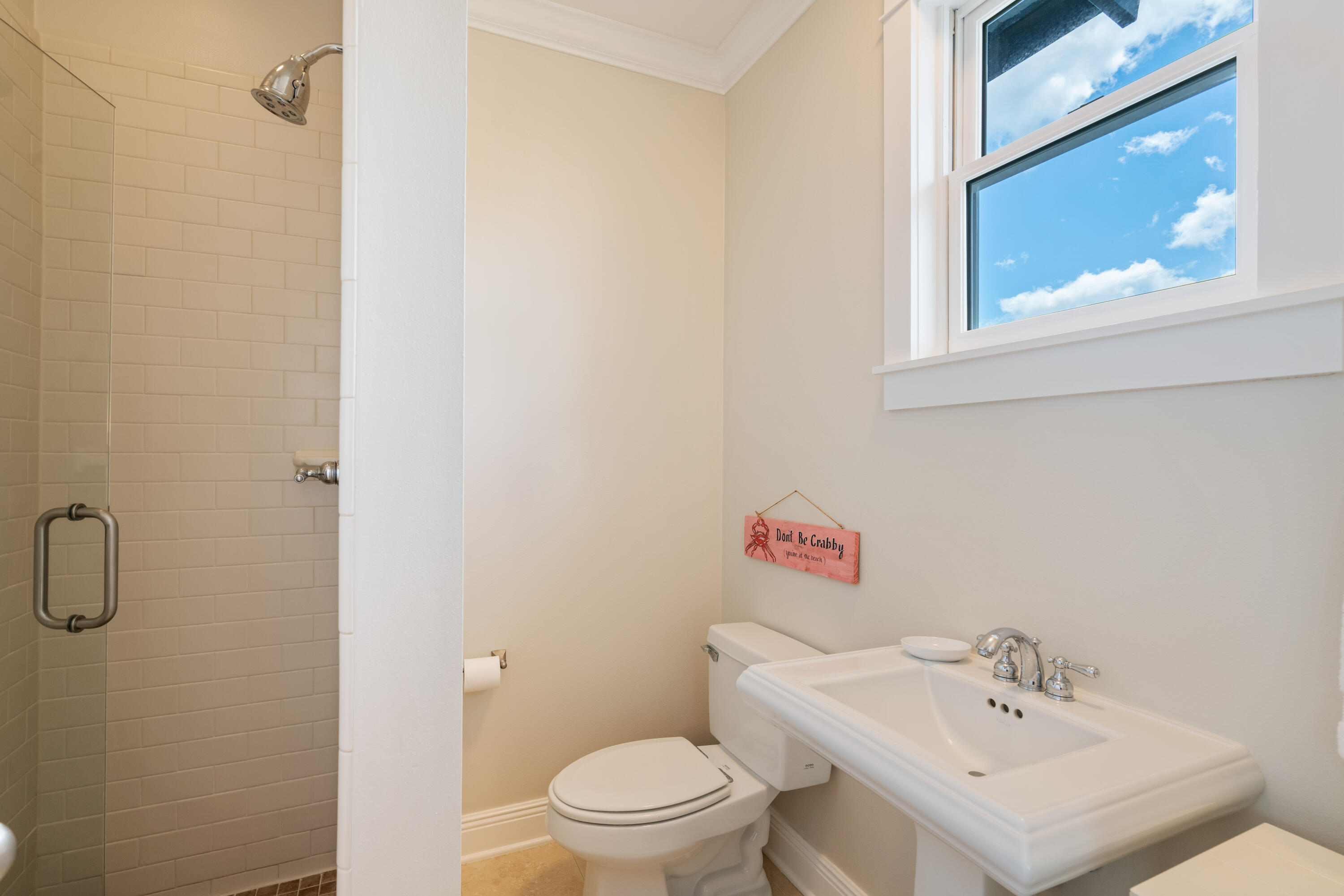 107 Chelsea Loop Road Santa Rosa Beach, FL 32459 - Photo 37 of 66 a bathroom with a sink a toilet and a mirror