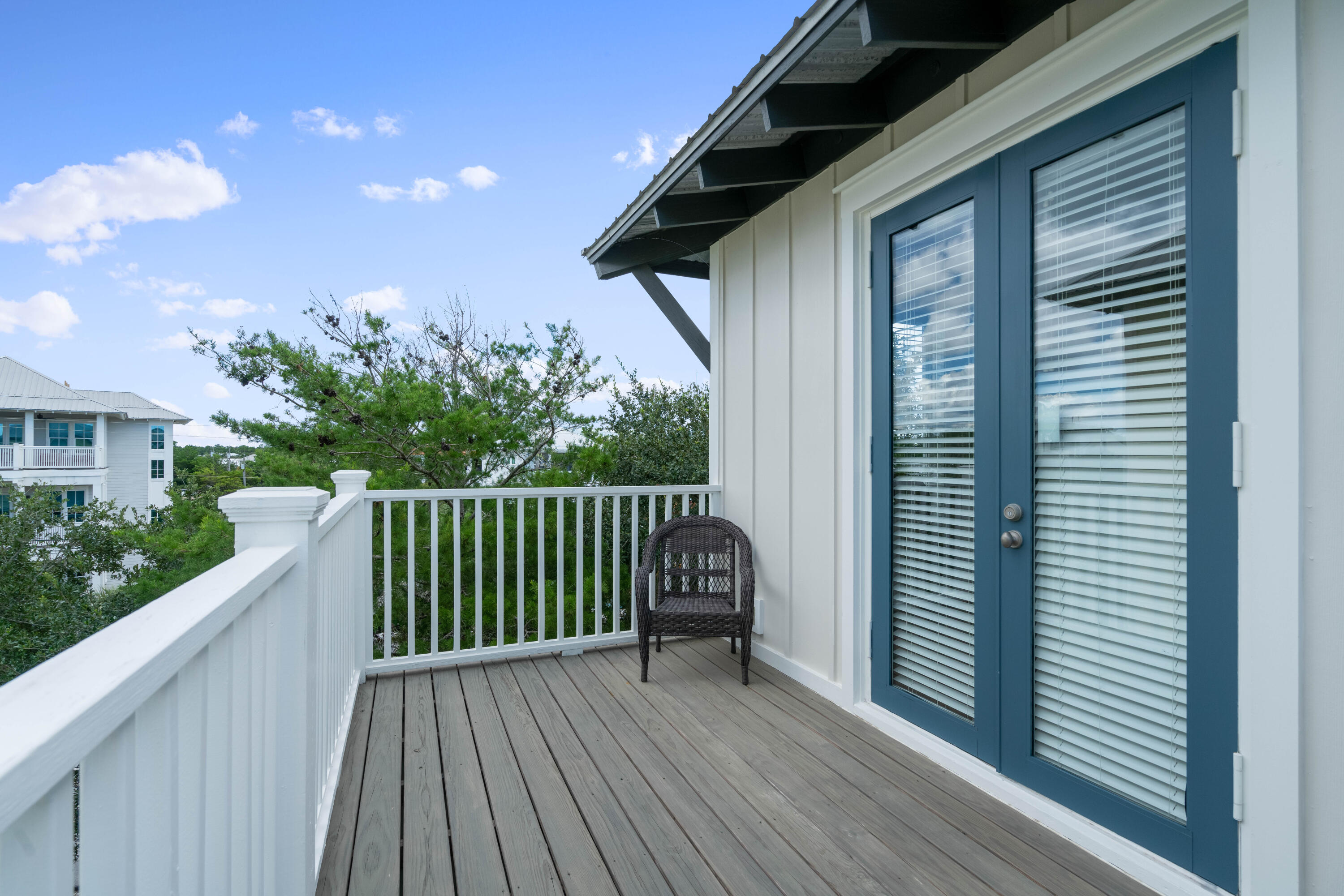 107 Chelsea Loop Road Santa Rosa Beach, FL 32459 - Photo 39 of 66 a view of a deck with wooden floor and fence with a garden