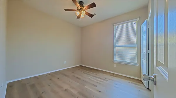 a view of a room that has a window in it