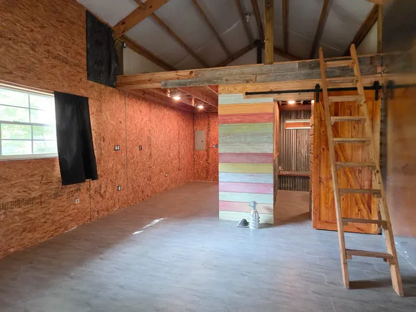 a view of an empty room with a fireplace