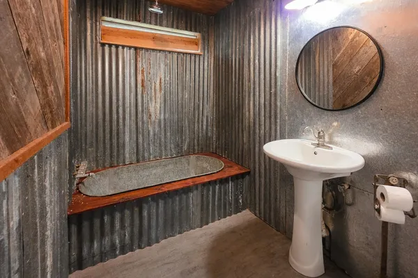 a bathroom with a sink and a mirror