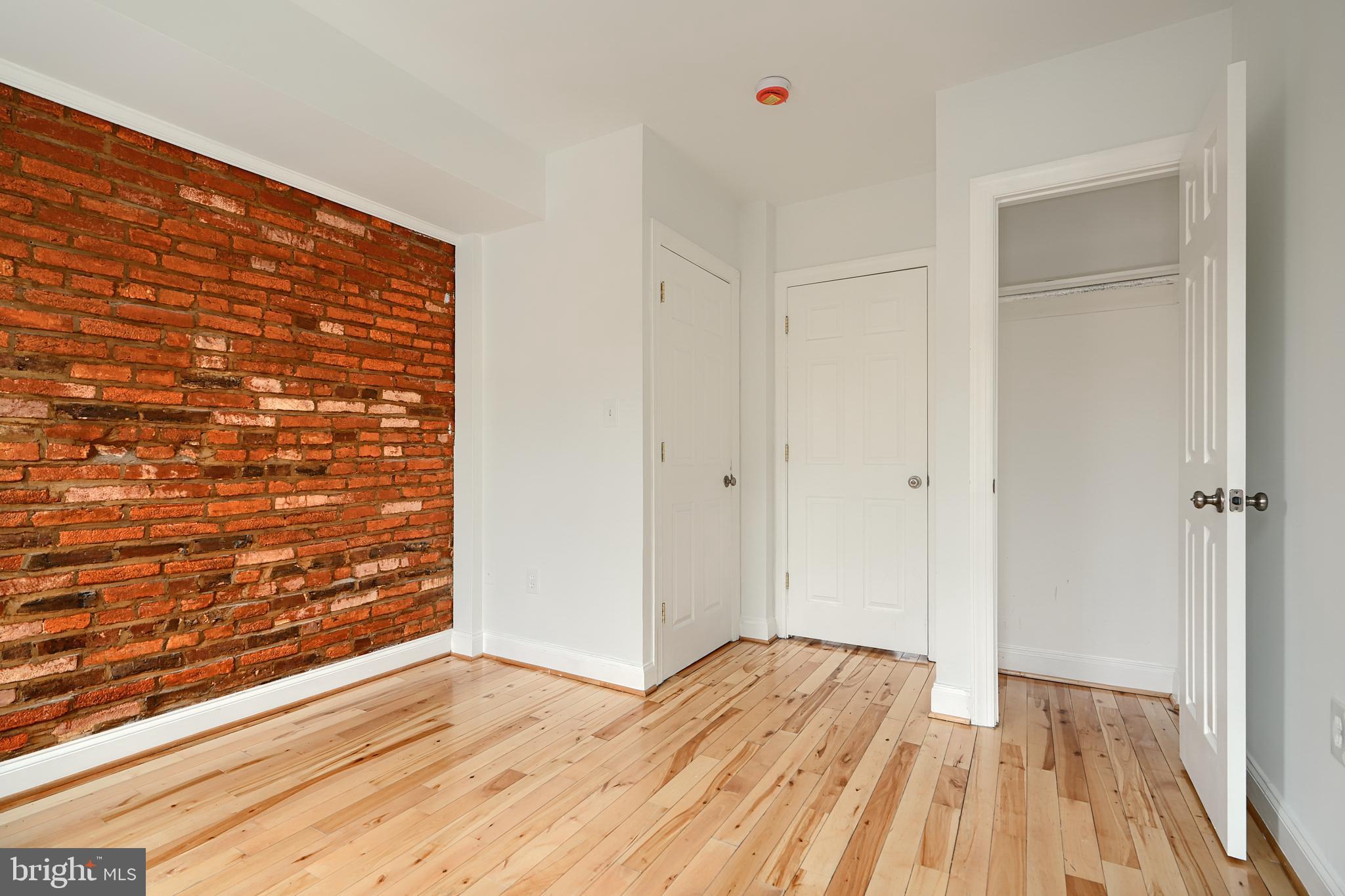 1600 Patapsco Street Baltimore, MD 21230 - Photo 18 of 40 a view of empty room with wooden floor and fan