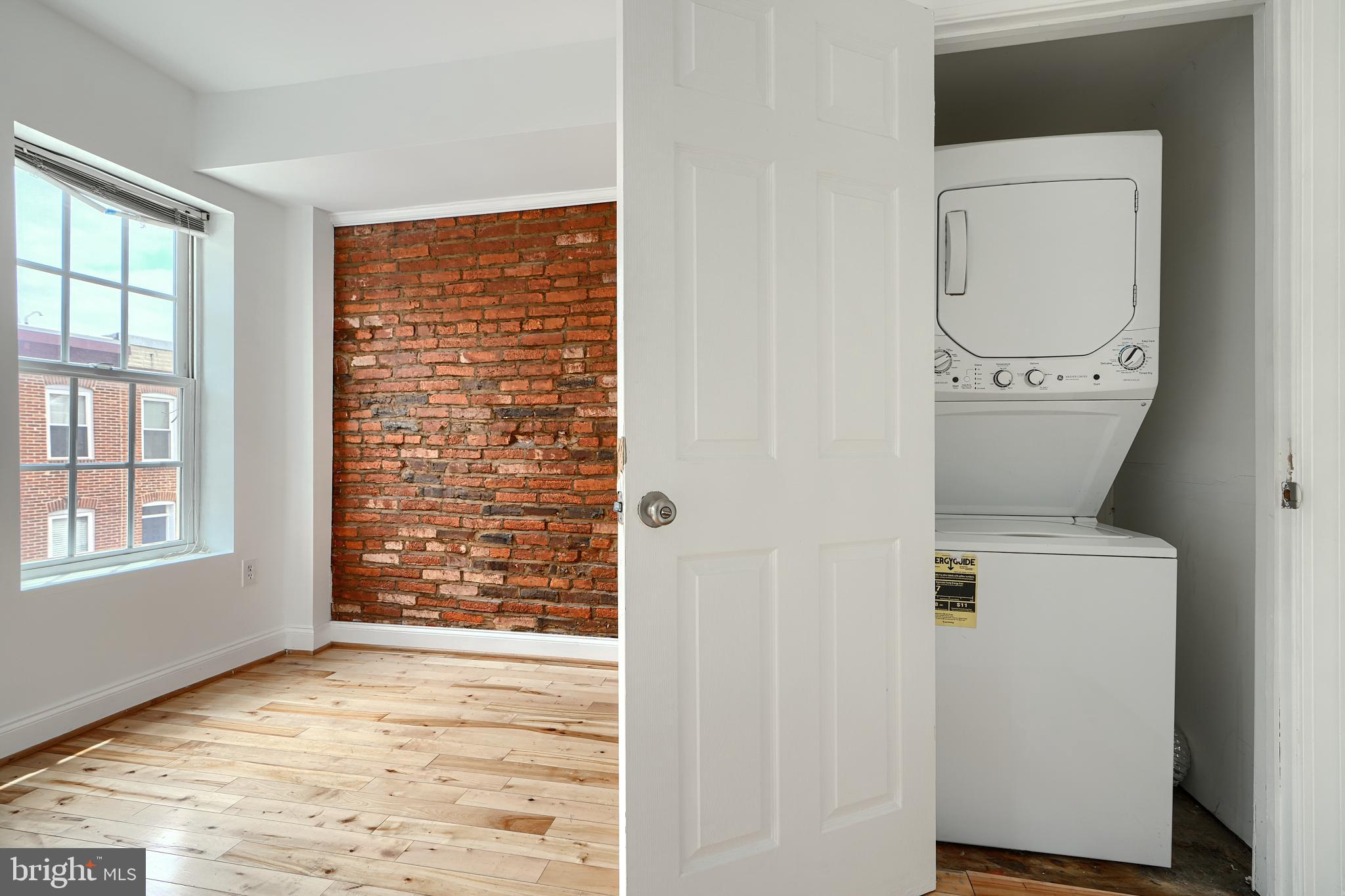 1600 Patapsco Street Baltimore, MD 21230 - Photo 19 of 40 an empty room with wooden floor and a window