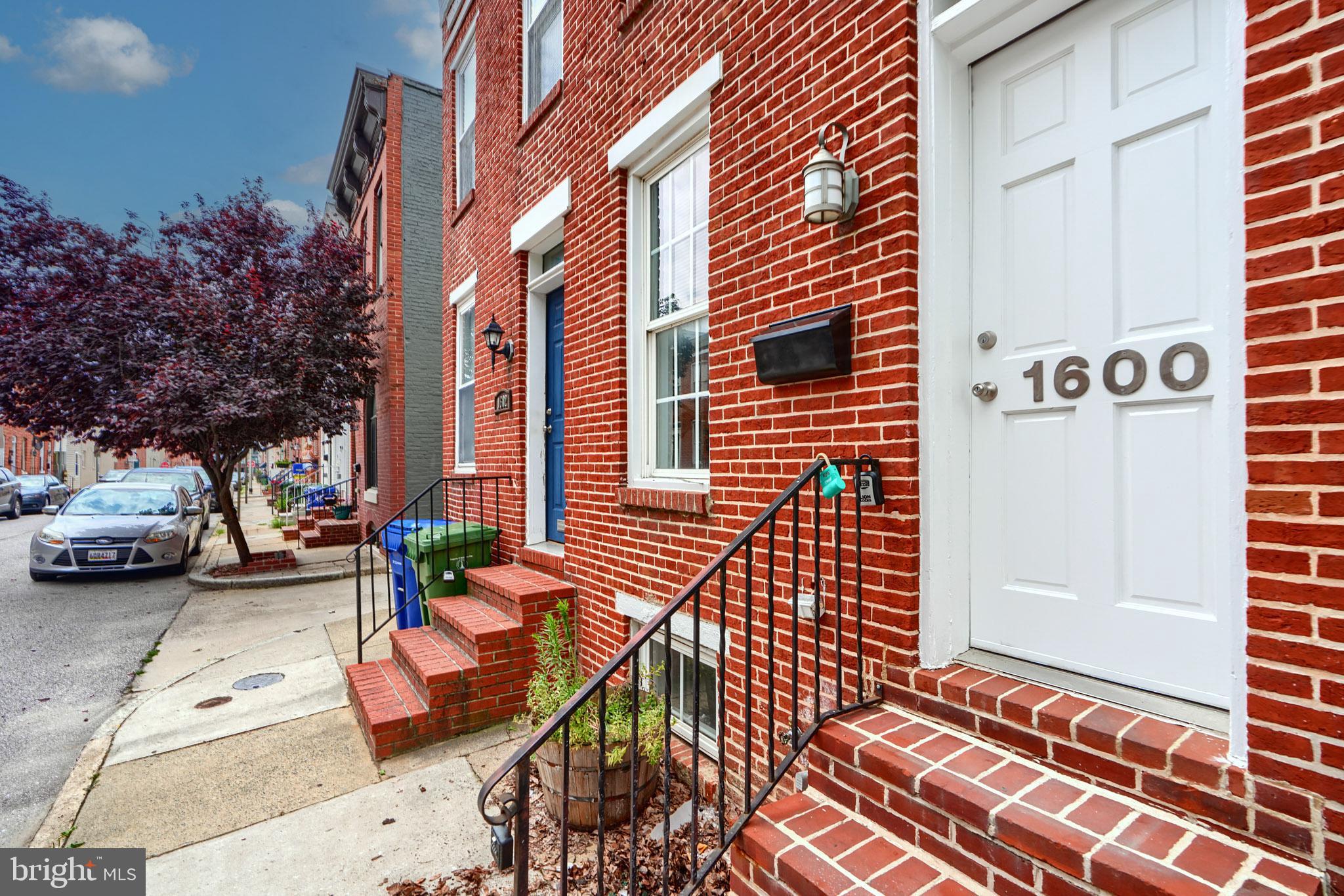 1600 Patapsco Street Baltimore, MD 21230 - Photo 2 of 40 a view of a patio with a table and chairs and potted plants