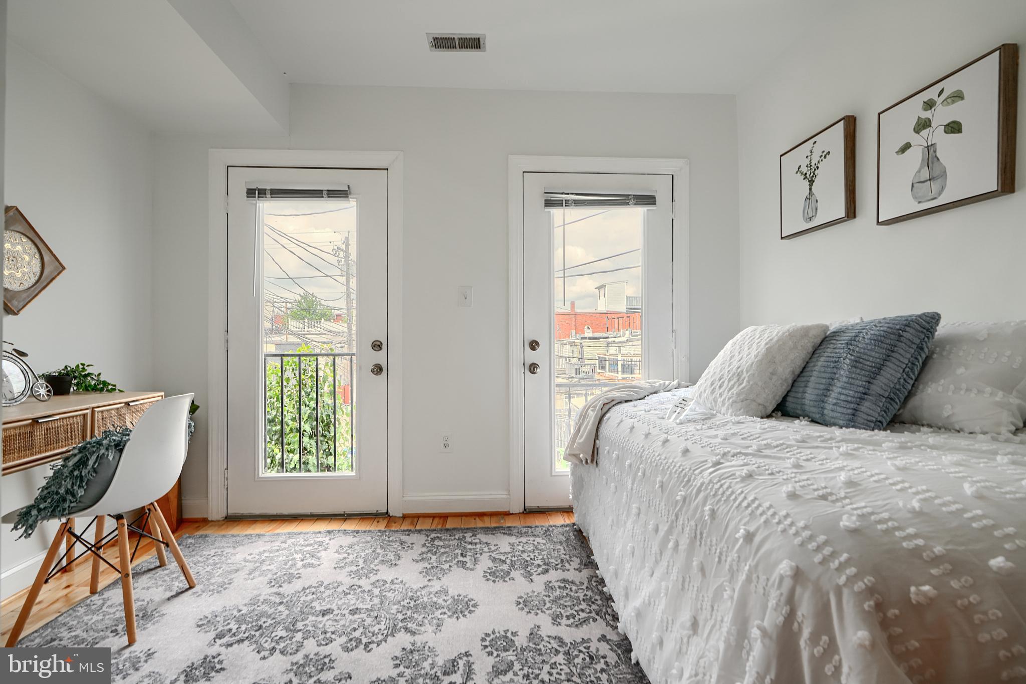 1600 Patapsco Street Baltimore, MD 21230 - Photo 21 of 40 a bedroom with a bed and a window