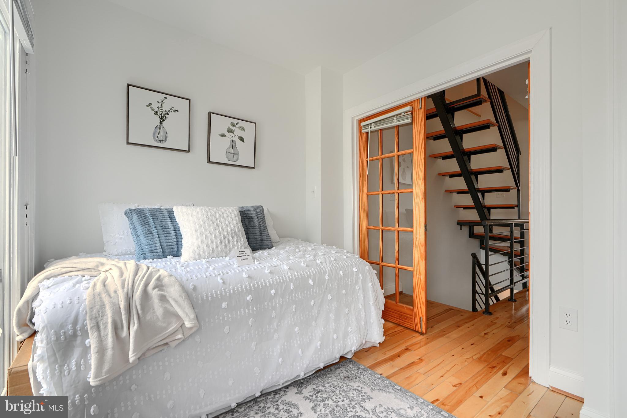 1600 Patapsco Street Baltimore, MD 21230 - Photo 22 of 40 a bed sitting in a bedroom next to a window
