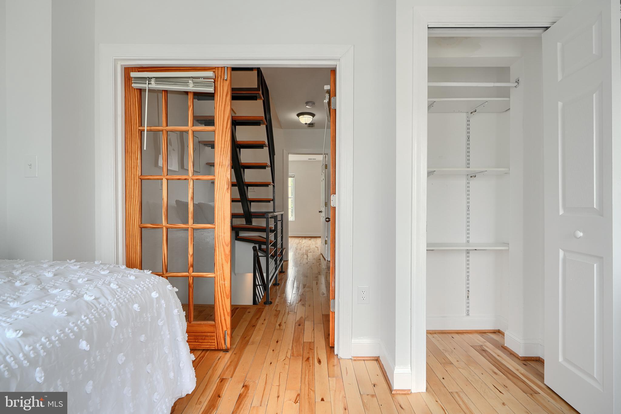 1600 Patapsco Street Baltimore, MD 21230 - Photo 23 of 40 a view of bedroom with a bed and wooden floor