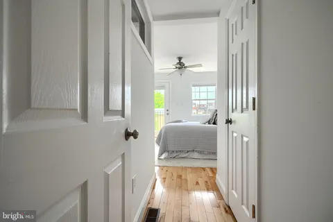 a bedroom with a bed and a potted plant