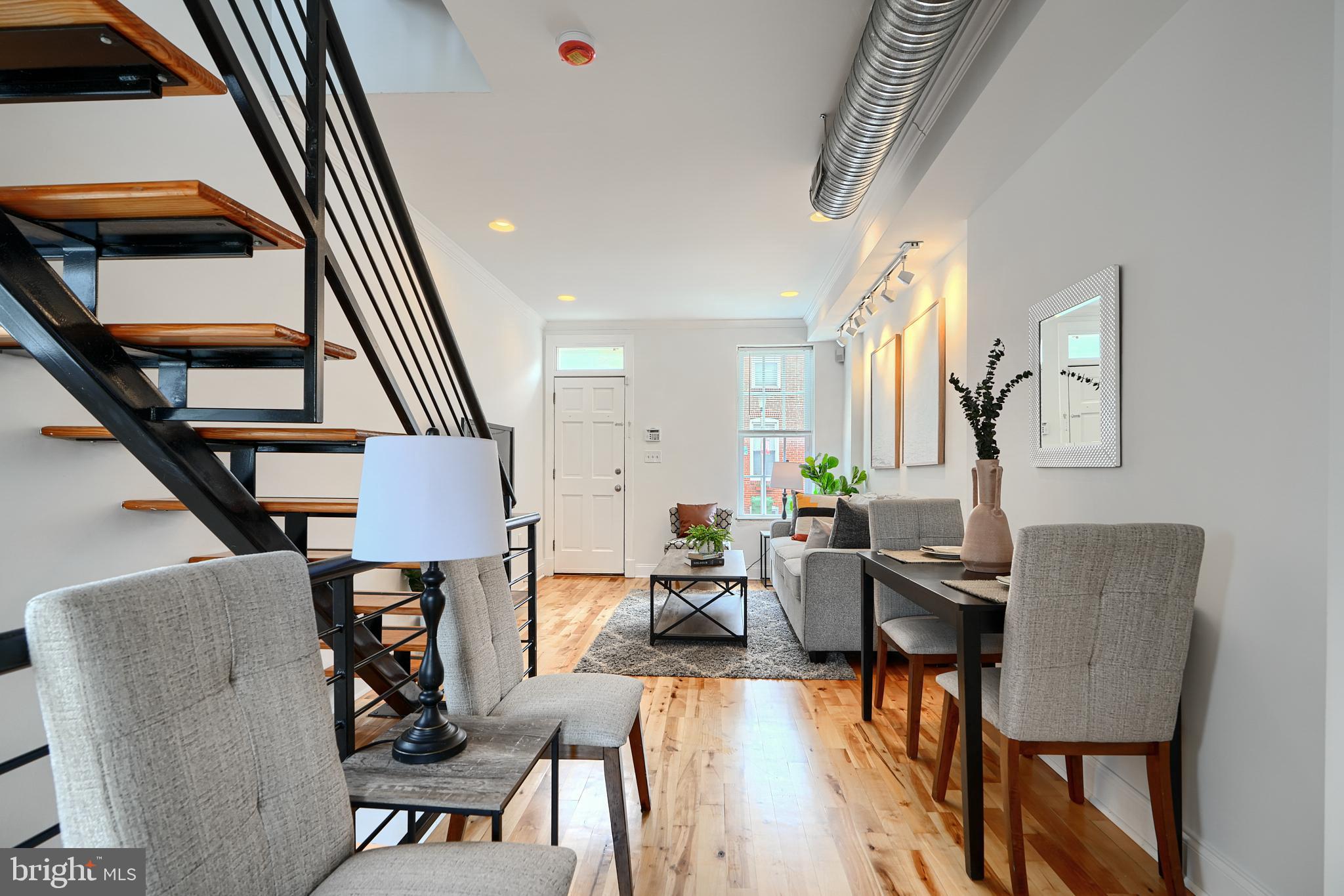 1600 Patapsco Street Baltimore, MD 21230 - Photo 7 of 40 a living room with furniture and a piano