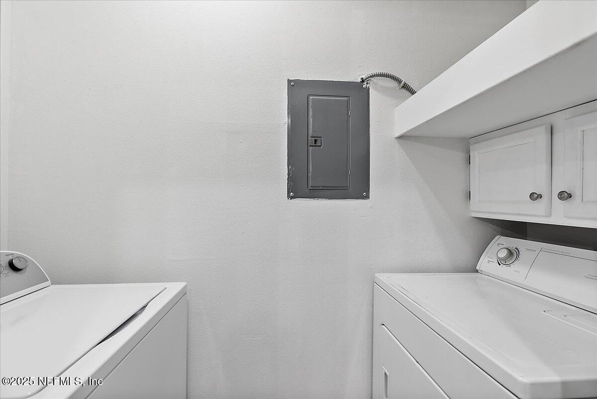 160 Veracruz Drive, Unit 422 Ponte Vedra Beach, FL 32082 - Photo 16 of 26 a utility room with dryer and washer
