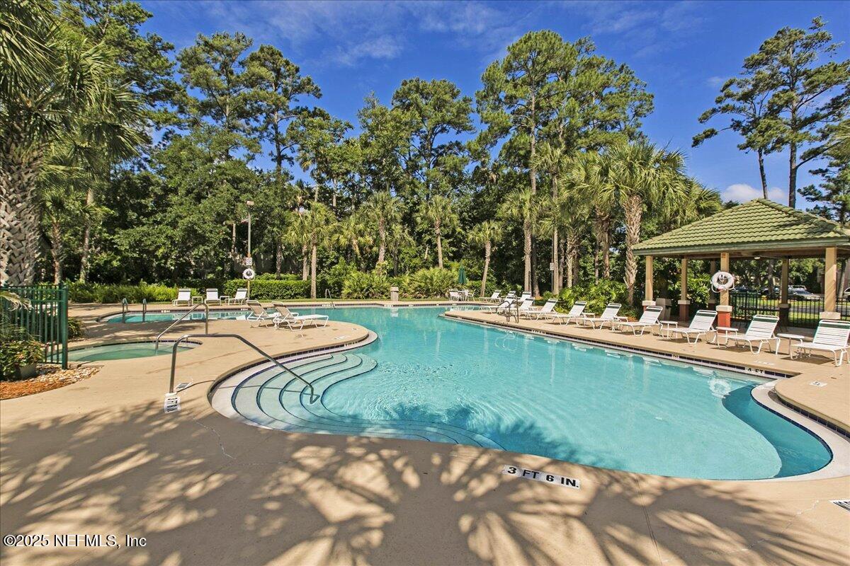 160 Veracruz Drive, Unit 422 Ponte Vedra Beach, FL 32082 - Photo 19 of 26 a view of a swimming pool with a patio