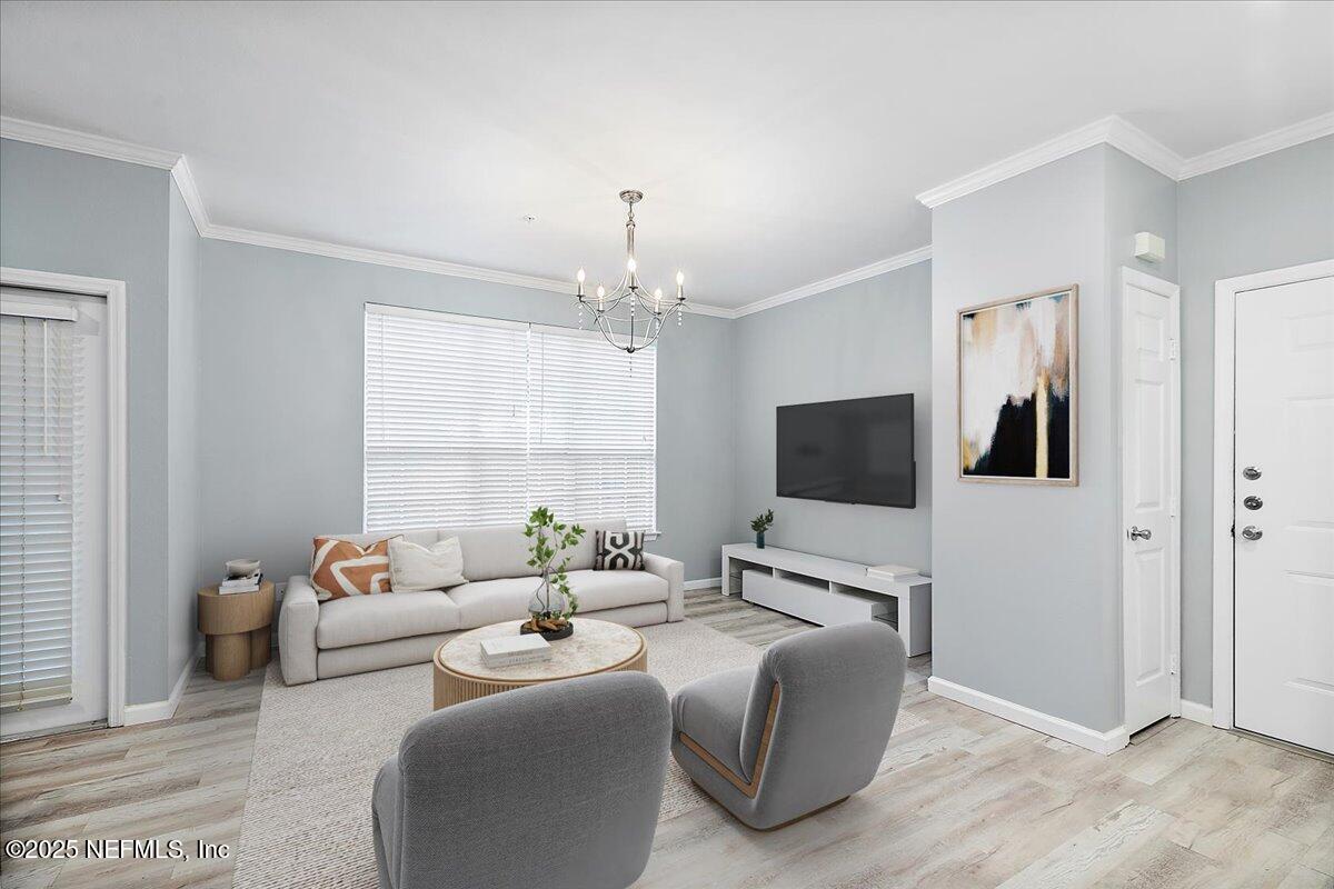 160 Veracruz Drive, Unit 422 Ponte Vedra Beach, FL 32082 - Photo 6 of 26 a living room with furniture and a flat screen tv