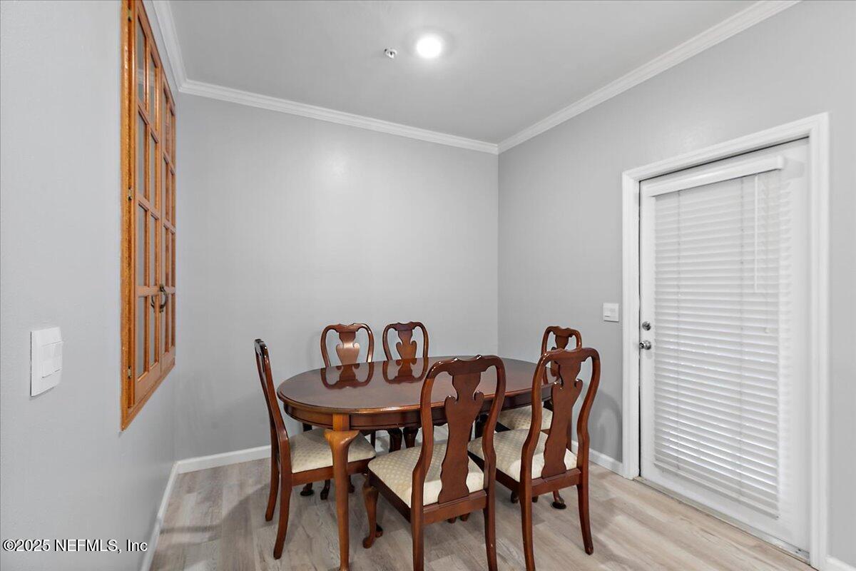160 Veracruz Drive, Unit 422 Ponte Vedra Beach, FL 32082 - Photo 8 of 26 a view of a dining room with furniture and window