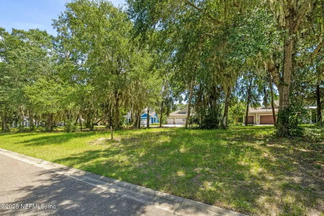 a view of a trees in front of a house