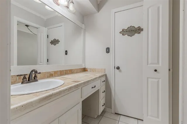a bathroom with a bathtub a sink and a window