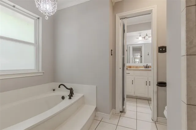 a bathroom with a sink vanity and a mirror