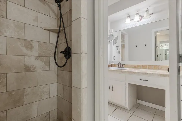 a bathroom with a granite countertop sink mirror and double