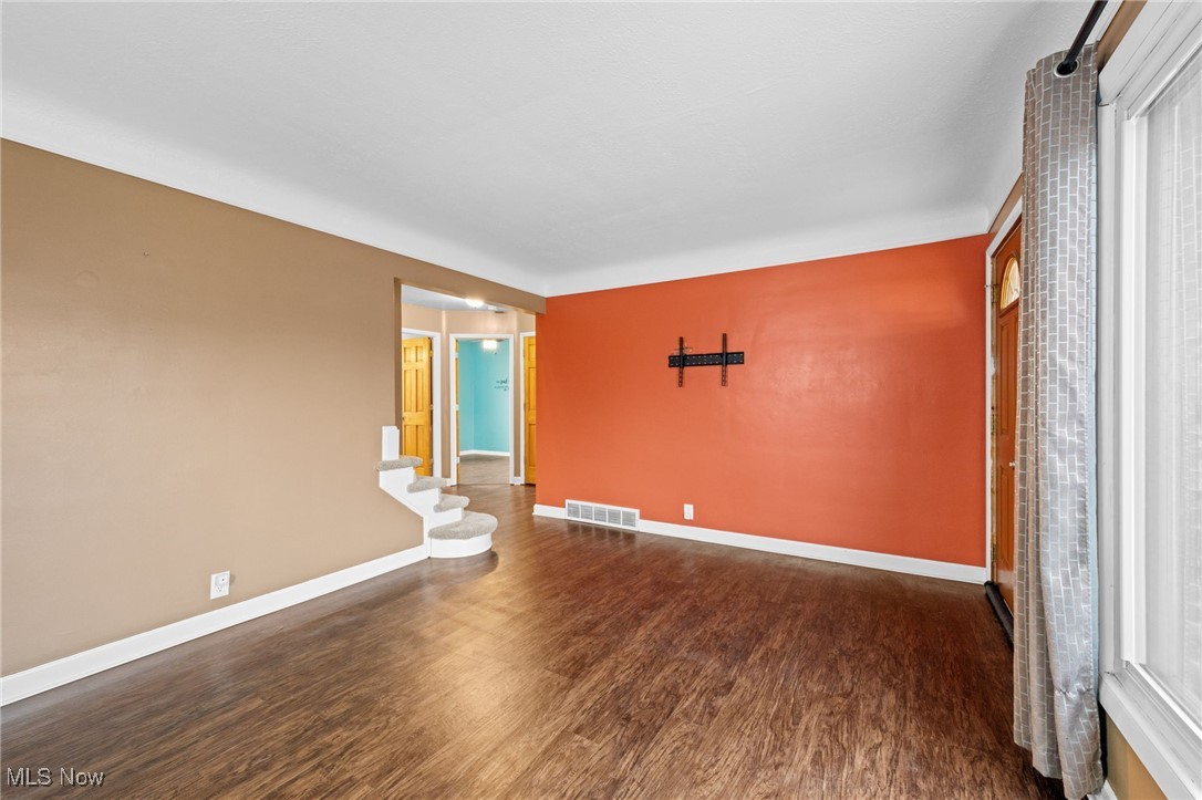 625 Pendley Road Willowick, OH 44095 - Photo 6 of 28 Empty room with baseboards and dark wood-style floors