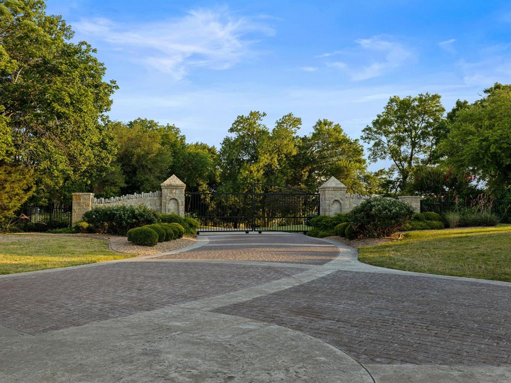 2115 Paradise Rnch Trail McKinney, TX 75071 - Photo 37 of 40 a view of a house with a big yard and a large trees