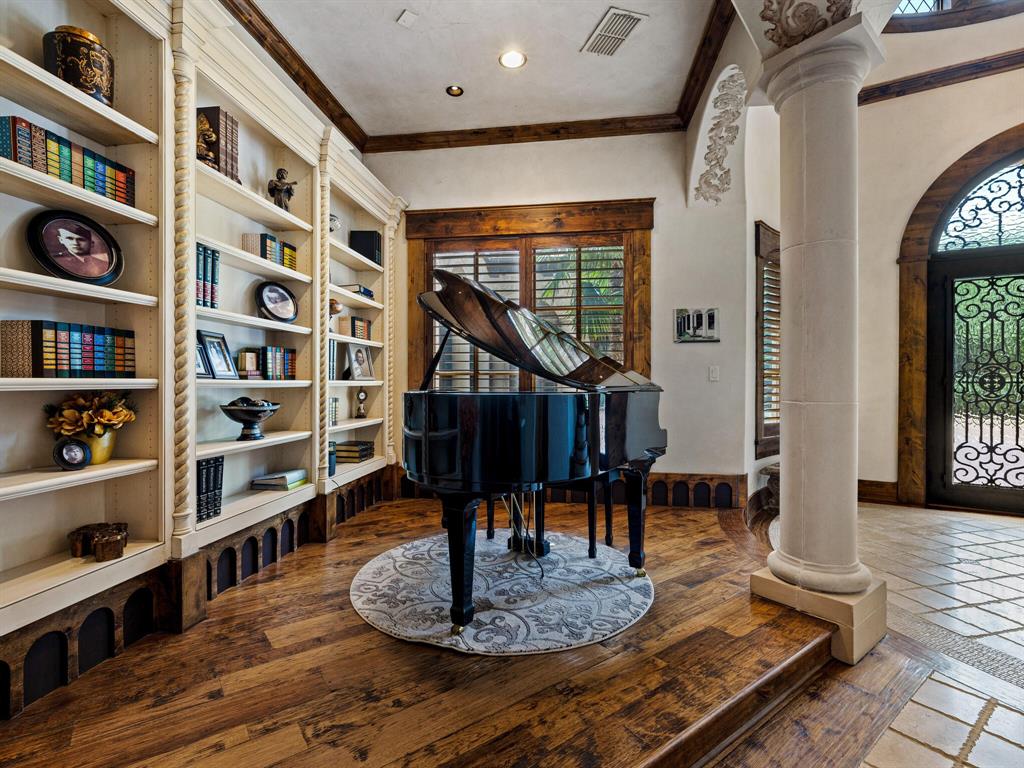 2115 Paradise Rnch Trail McKinney, TX 75071 - Photo 6 of 40 a living room with furniture and a book shelf