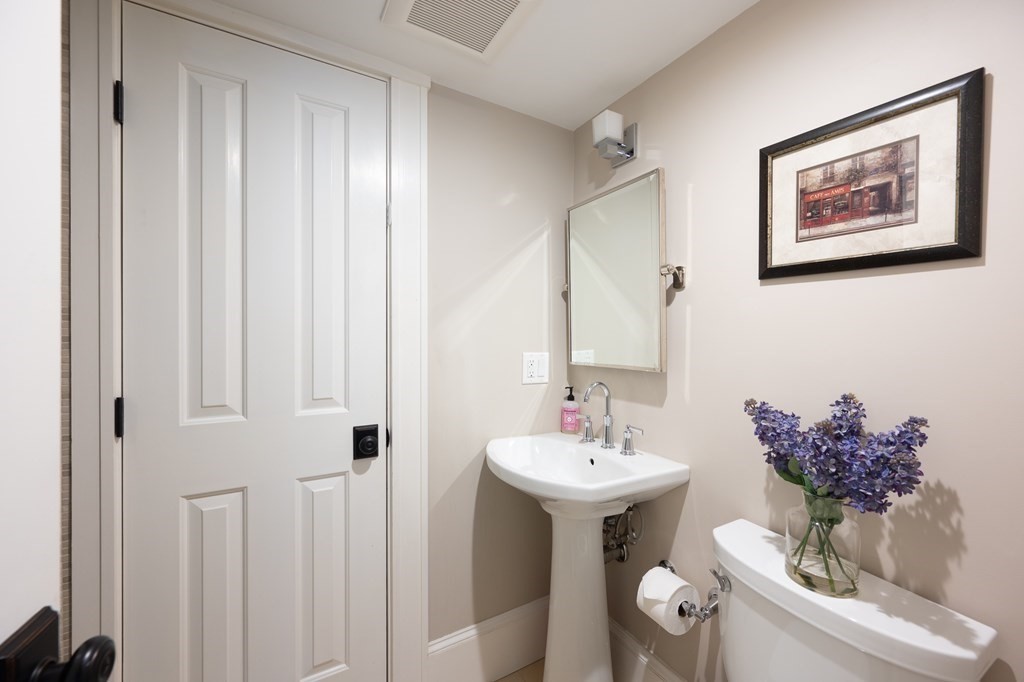 5 Dwight Street, Unit 1 Boston, MA 02118 - Photo 11 of 22 a bathroom with a sink and mirror with toilet