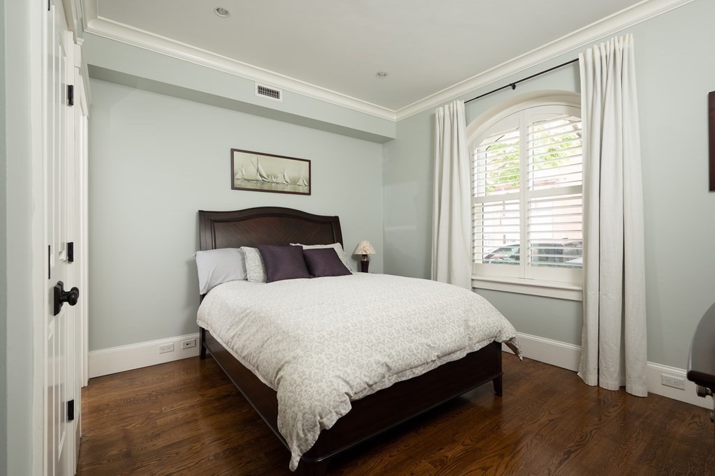 5 Dwight Street, Unit 1 Boston, MA 02118 - Photo 16 of 22 a bedroom with a bed and a window