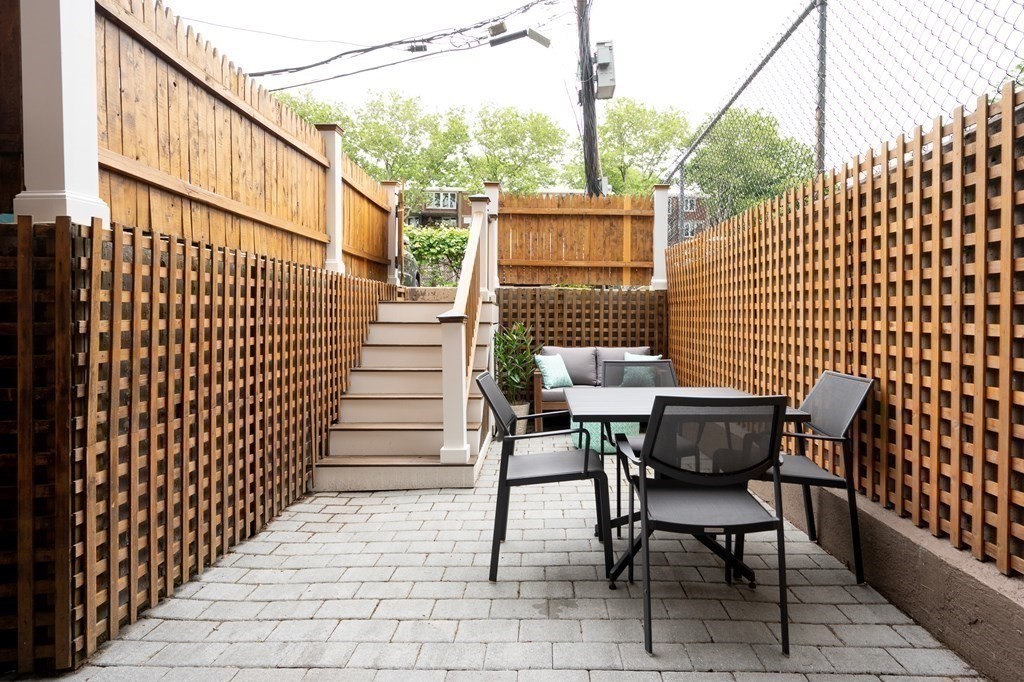 5 Dwight Street, Unit 1 Boston, MA 02118 - Photo 18 of 22 a view of a chairs and table in the balcony