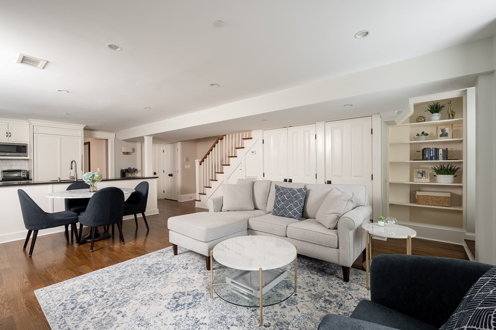 5 Dwight Street, Unit 1 Boston, MA 02118 - Photo 5 of 22 a living room with furniture a rug and a dining table