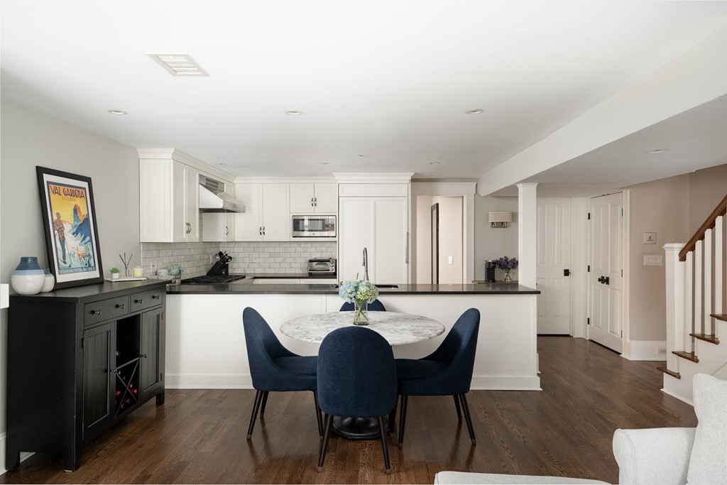 5 Dwight Street, Unit 1 Boston, MA 02118 - Photo 9 of 22 a kitchen with stainless steel appliances granite countertop a dining table and chairs