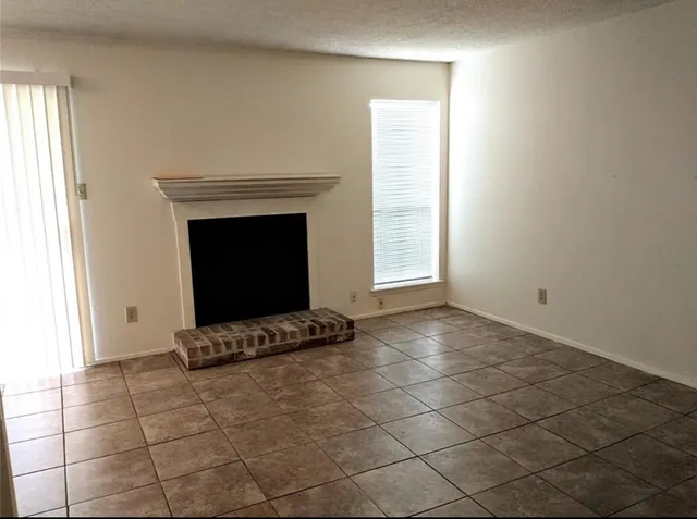 an empty room with kitchen