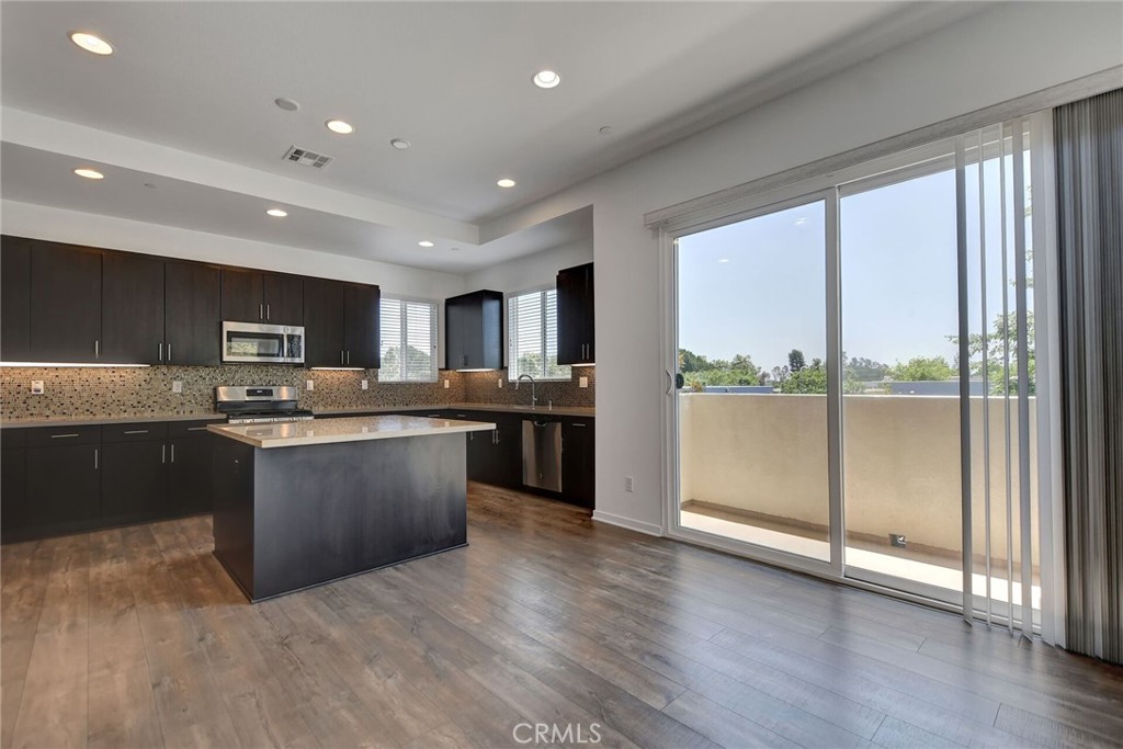 711 Brooklyn Drive Brea, CA 92821 - Photo 12 of 30 a large kitchen with a large counter top appliances and cabinets